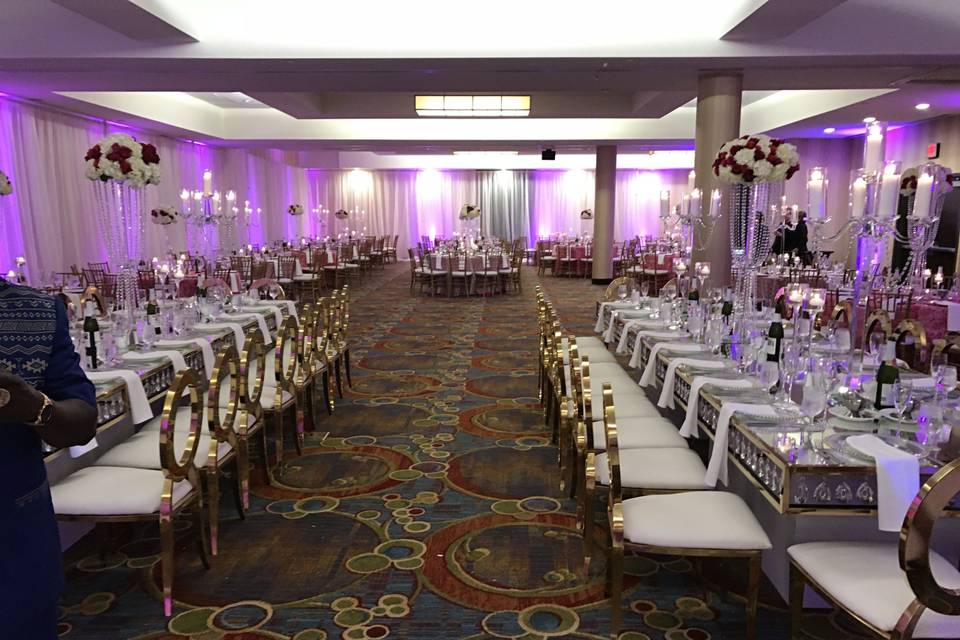 Custom specialty gold chairs and crystal tables brings a new level of elegance to