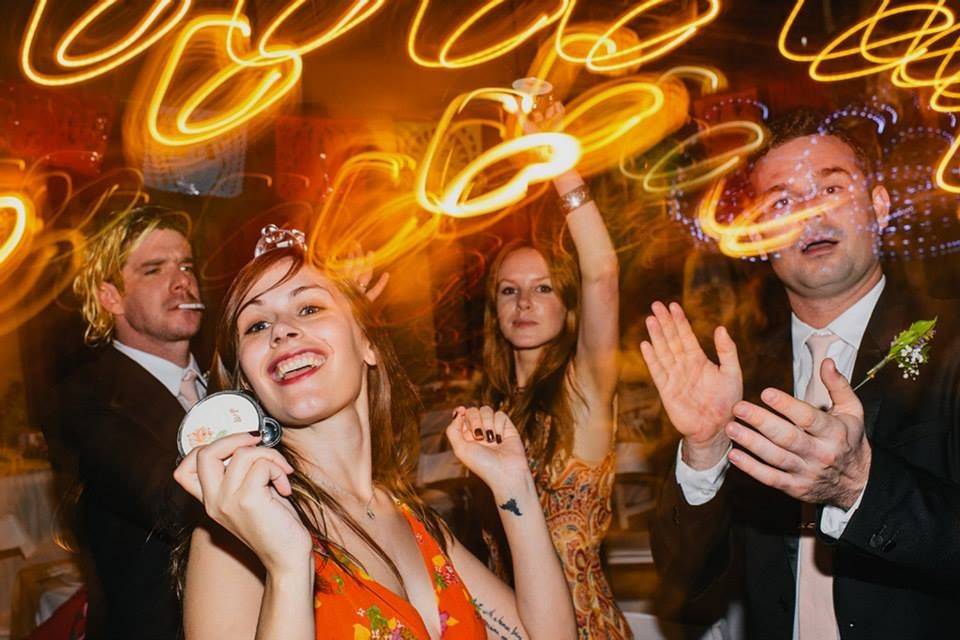 Our custom mini tambourines in action! They were a huge hit on the dance floor.Photo by Rick Collins