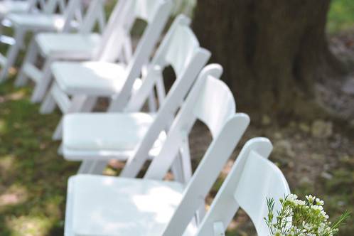 White wooden chairs. Available for rent.