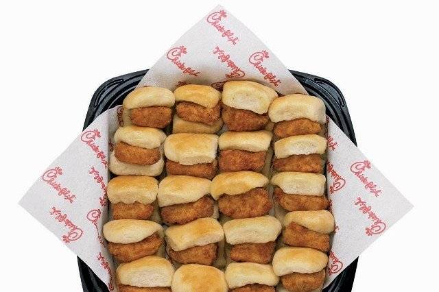 Chick-fil-A Chick-n-Minis TrayBite-size Chick-fil-A Nuggets nestled in mini yeast rolls that are lightly coated with honey butter spread.