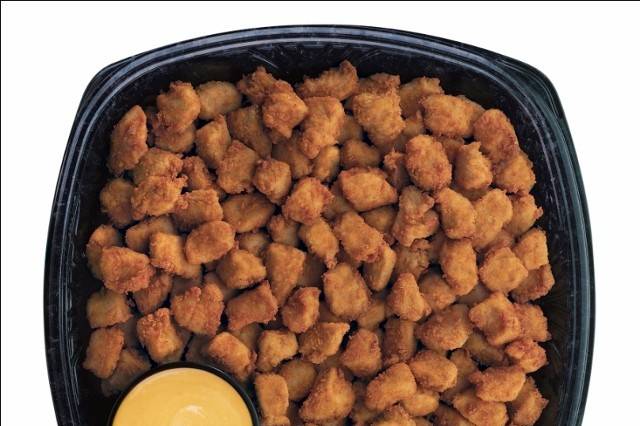 Chick-fil-A Nuggets TrayBite-size pieces of tender all-breast chicken meat served with your choice of dipping sauces.  Purchase this tray hot and ready to serve, or cooked and chilled to be reheated later. Ask for details.