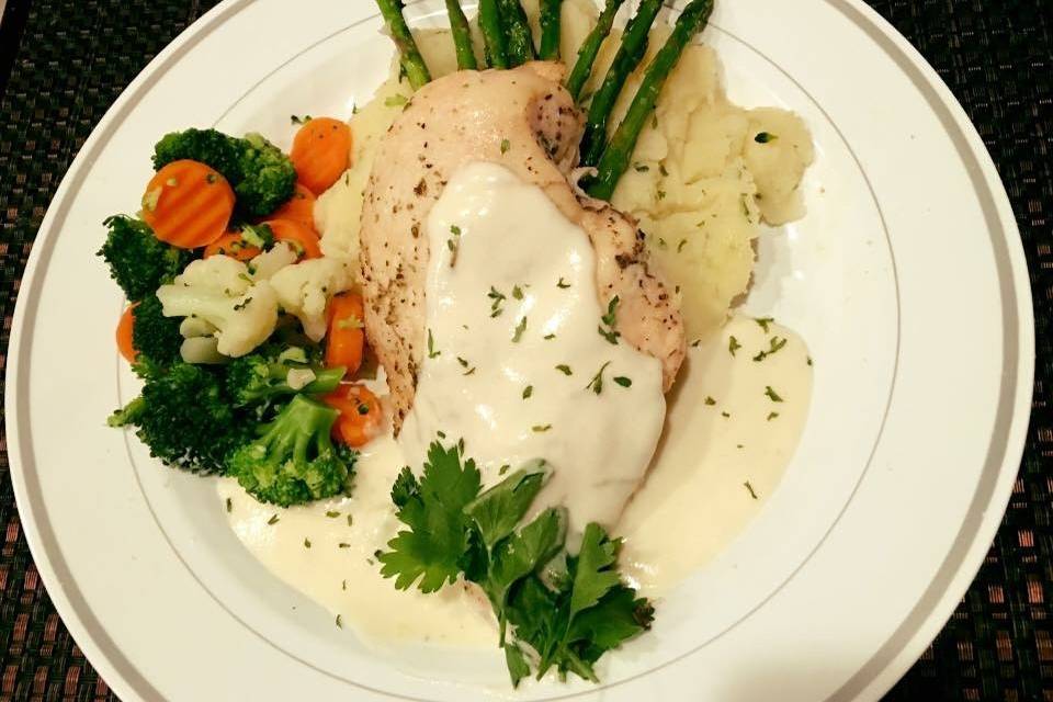 Herb Chicken with Rosemary Lemon sauce over garlic mashed potatoes and steamed asparagus spears.