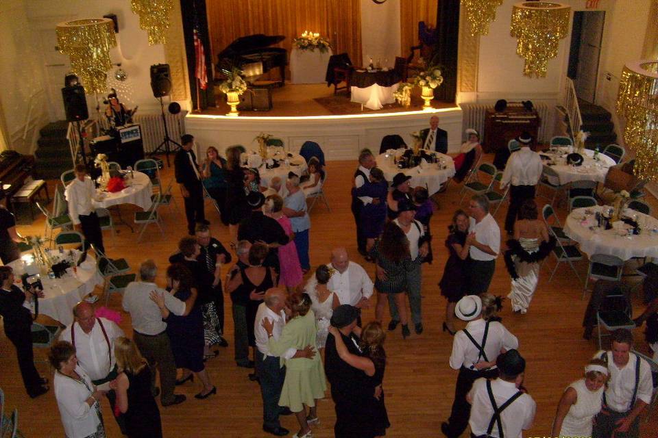 Guests dance at the reception