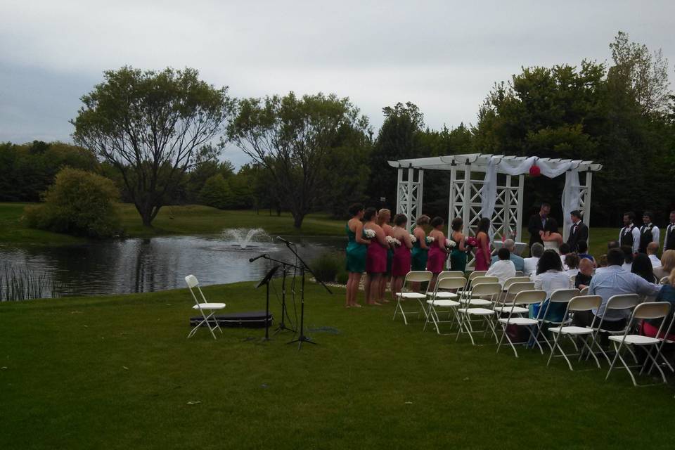 Wedding ceremony in front of pond