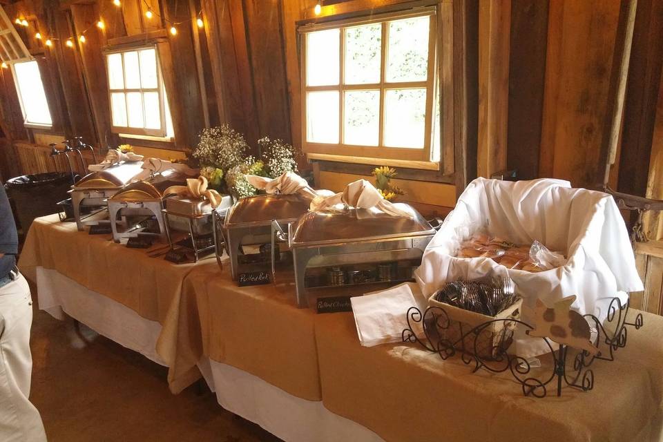 Theme is rustic. Beautiful barn venue. Accents of burlap decor.