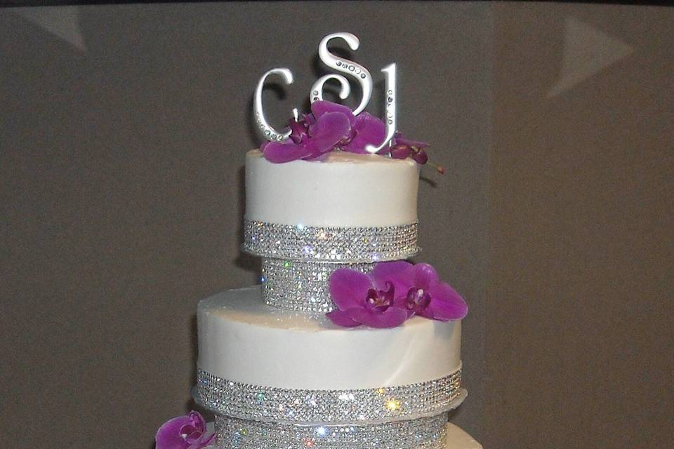 Wedding cake with purple flowers