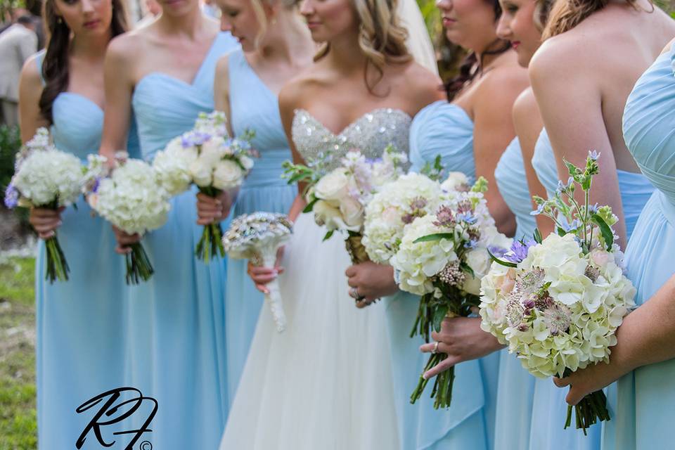 Bridesmaids bouquets of hydrangea, astrantia, twedia, sweetheart roses