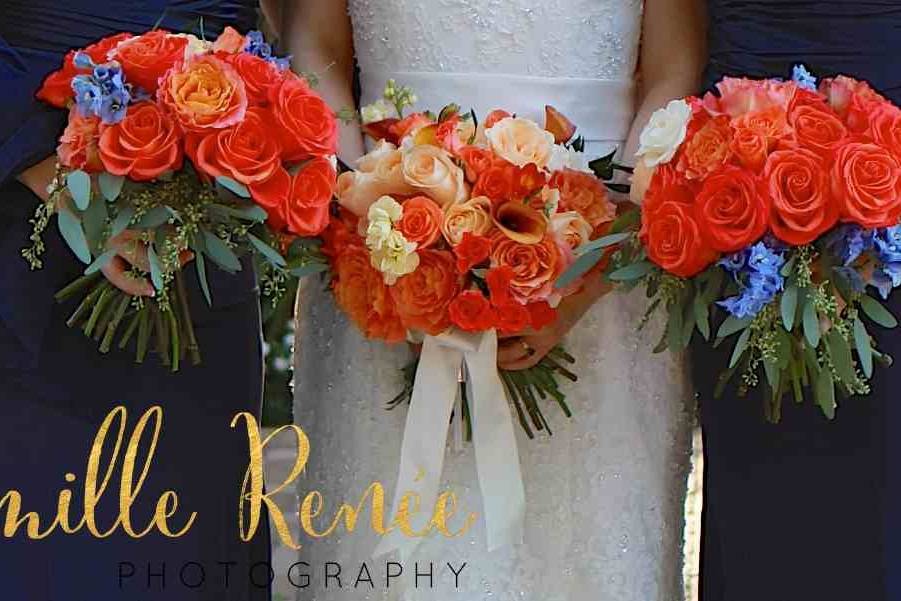 The bride with her bridesmaids holding a bouquet