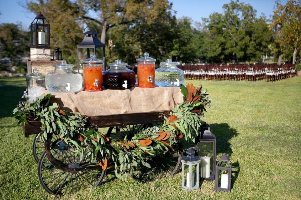 Rustic beverage wagon provides refreshments before ceremony.