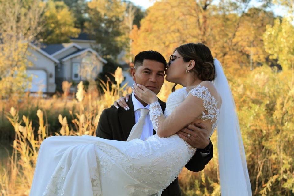 In his arms