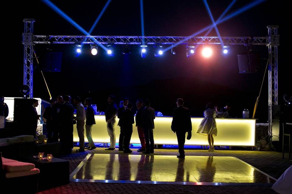 Dance floor, illuminated bar and party lights