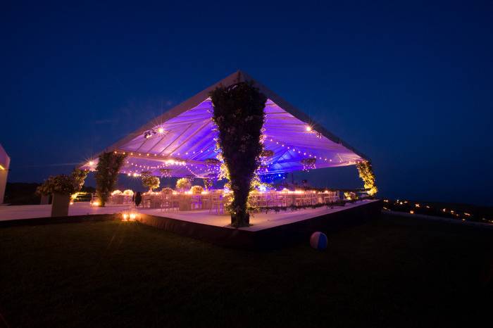 Stage construction and purple lighting for wedding