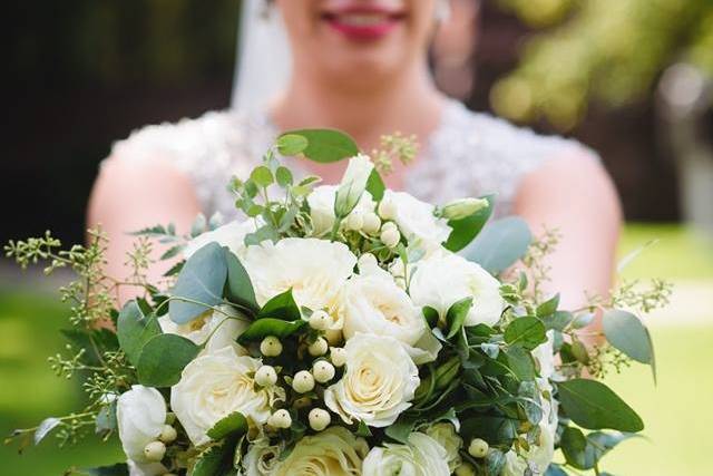 Bride holding out her bouquet