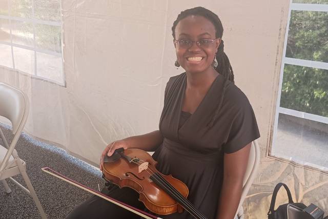 Live Violin Music Under a Tent