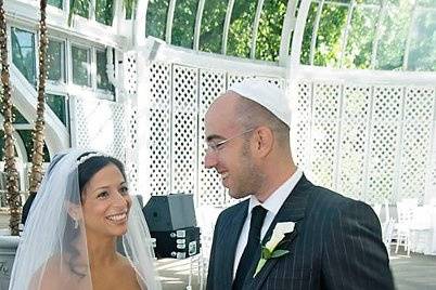 Brooklyn Botanical Ggarden, New York. Jewish wedding. Bride and groom in reception area.