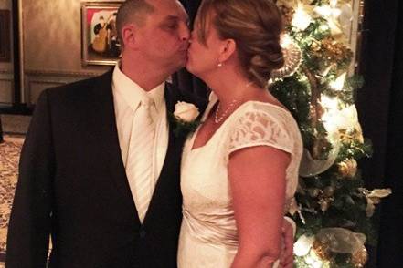 Groom kissing his bride