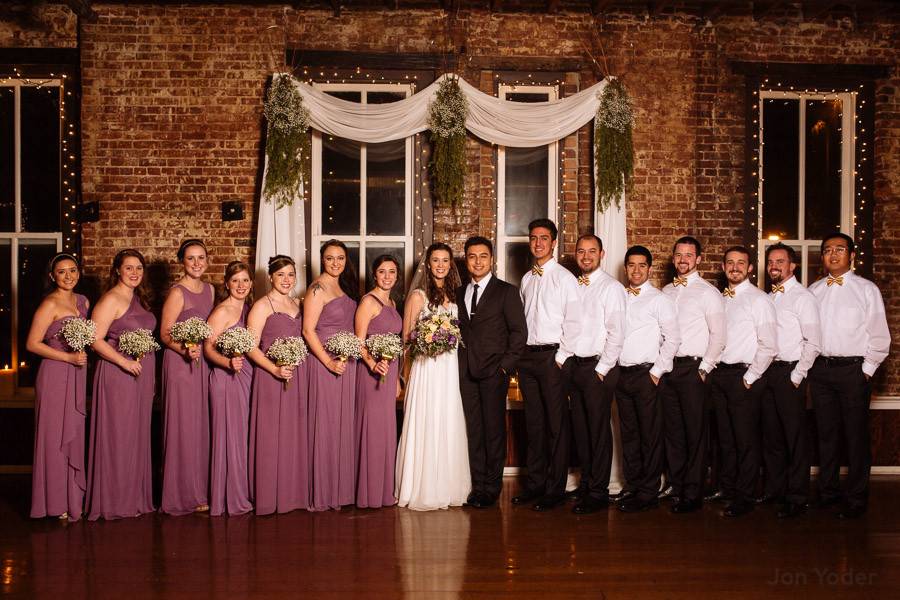 Newlyweds, bridesmaids, and groomsmen