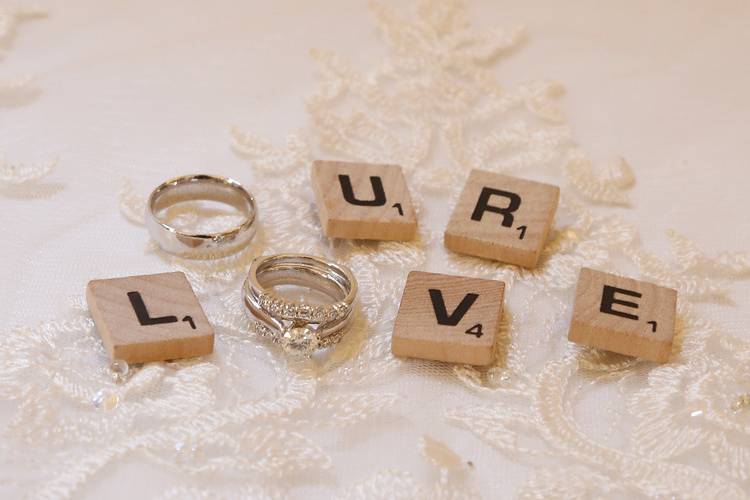 Wedding rings and scrabble letters