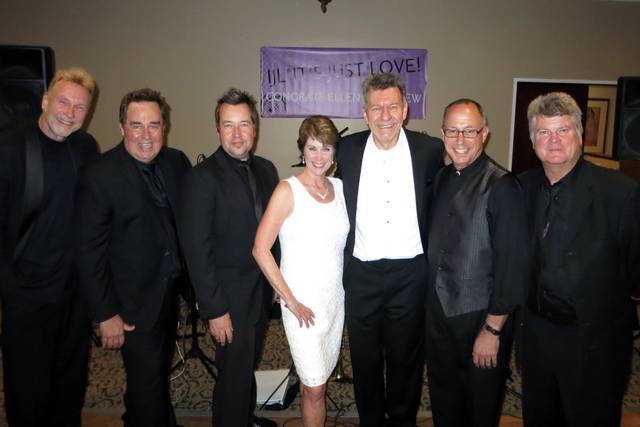The bride & groom with 5 members of the band (out of 7).