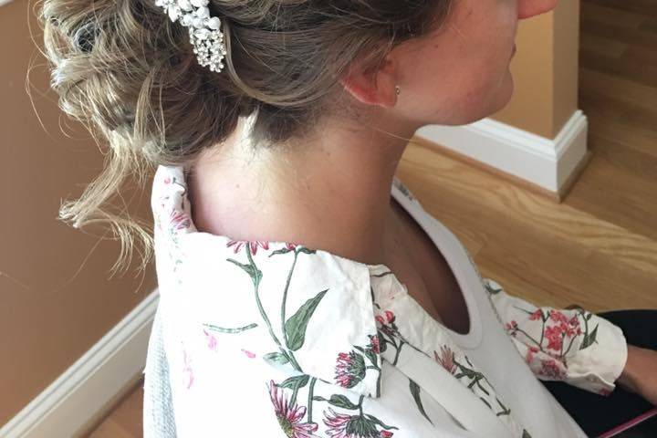 Braided updo with hair pin.