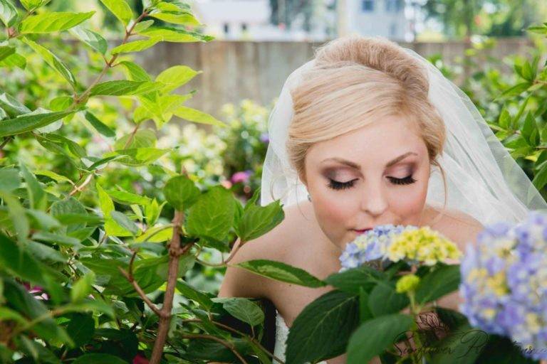 Bride smelling flowers