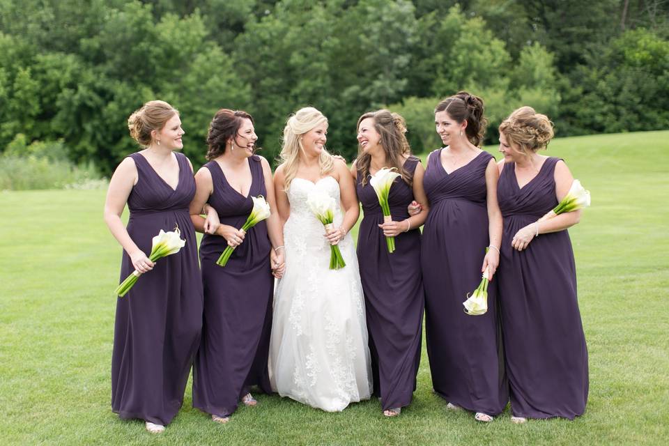 Bridesmaids looking fabulous in their deep purple dresses