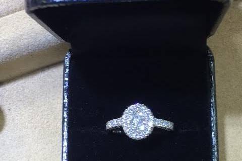 Oval diamond with halo setting and diamond band