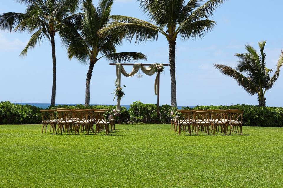 Rustic arch and crossback chairs. Florals by Easley Designs