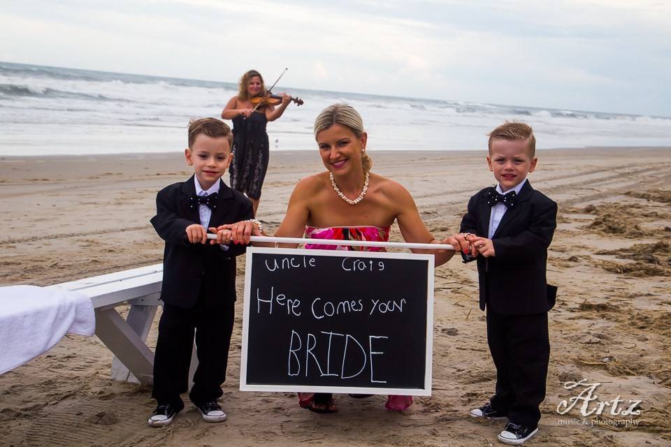 Bride holding a chalkboard sign