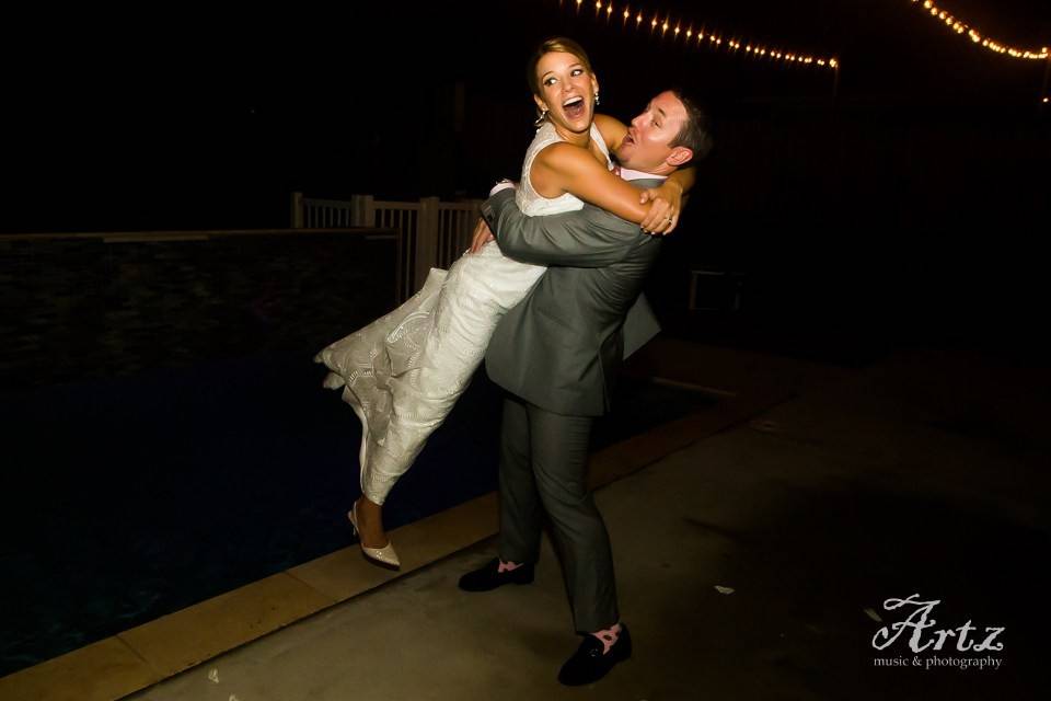 Groom lifts his bride