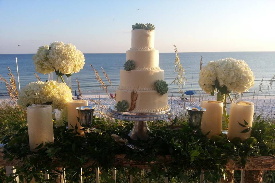 4-tier wedding cake and bouquets