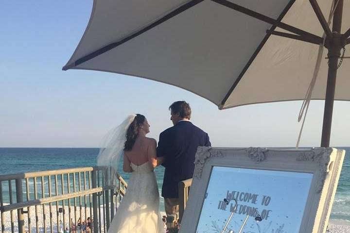 Newlyweds overlooking the beach