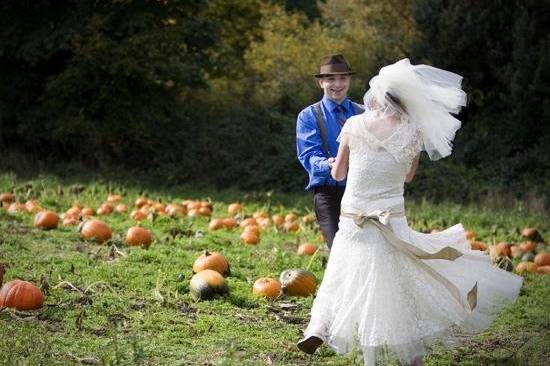 Fun,lovable,fall wedding,young couple,pumpkin patch