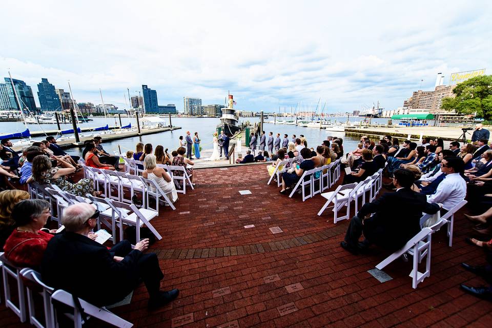 Ceremony on waterfront terrace