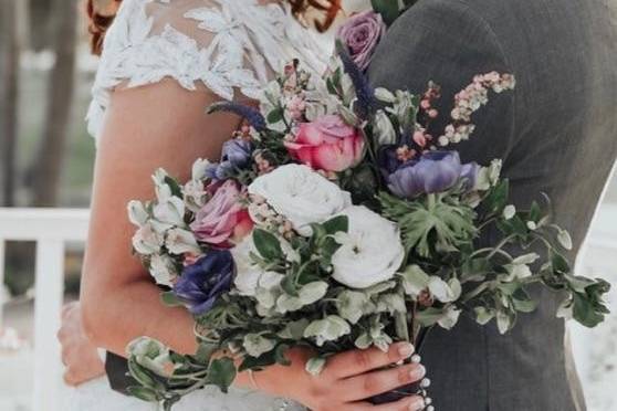 Purple and green wedding flowers. bridal bouquet, wedding flowers, garden roses, hellebore, anemone, golf course wedding