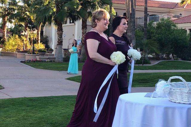 Touching moment when both brides' moms carried half her bouquet.