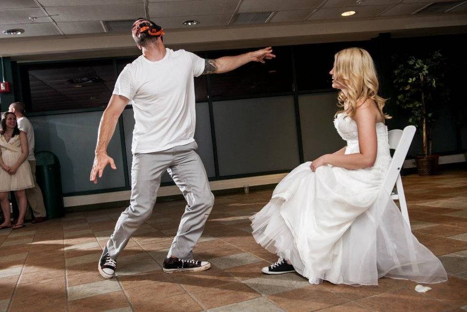 Groom dancing for the bride