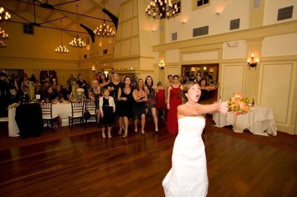 Throwing her bouquet