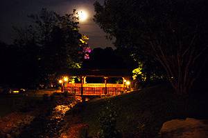 A beautiful moonlit night of the Covered Bridge at The Villa at Springwood