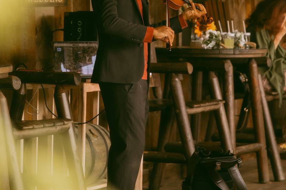 Violinist Plays on Porch