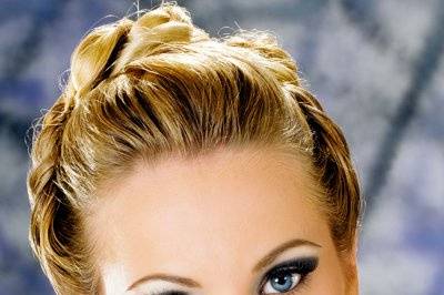 Blond with updo, necklace & glamorous, dramatic eyeshadow make-up.