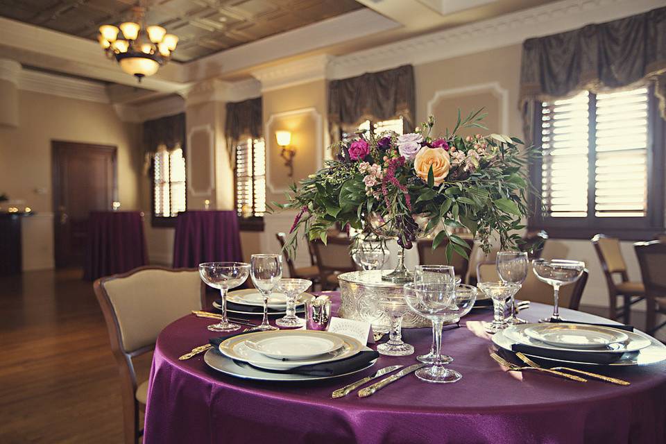 Table set for wedding with purple tablecloth, photo credit: epagaFOTO