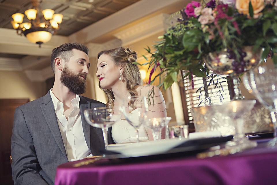 Couple sit at table, photo credit: epagaFOTO