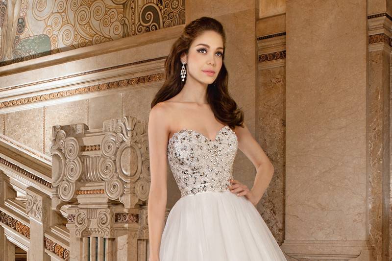 567This dreamy ball gown features a sweetheart neckline with a jewel- encrusted bodice, low v-back and chapel train.