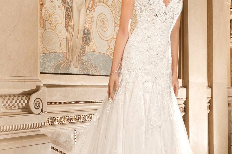 1481This sultry strapless, form -fitting gown with soft sweetheart neckline and illusion insert is adorned with embroidered lace and accents of delicate beading on the bodice. The back features a lace-up closure and sweep train.