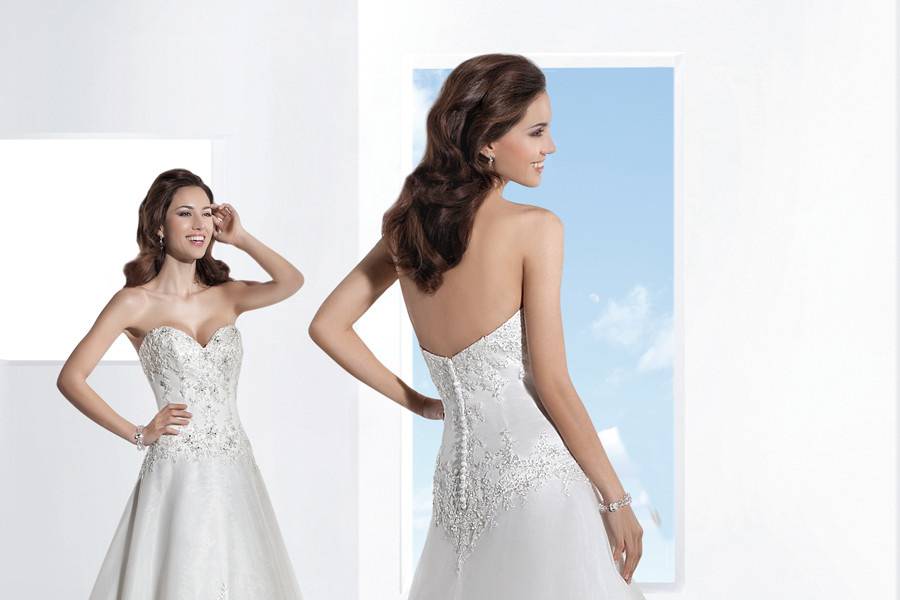 1455Beaded Venice lace fit n flare, strapless wedding gown with a Sweetheart neckline and buttons on back. This bridal dress features an attached Chapel train. Beaded belt sold separately.