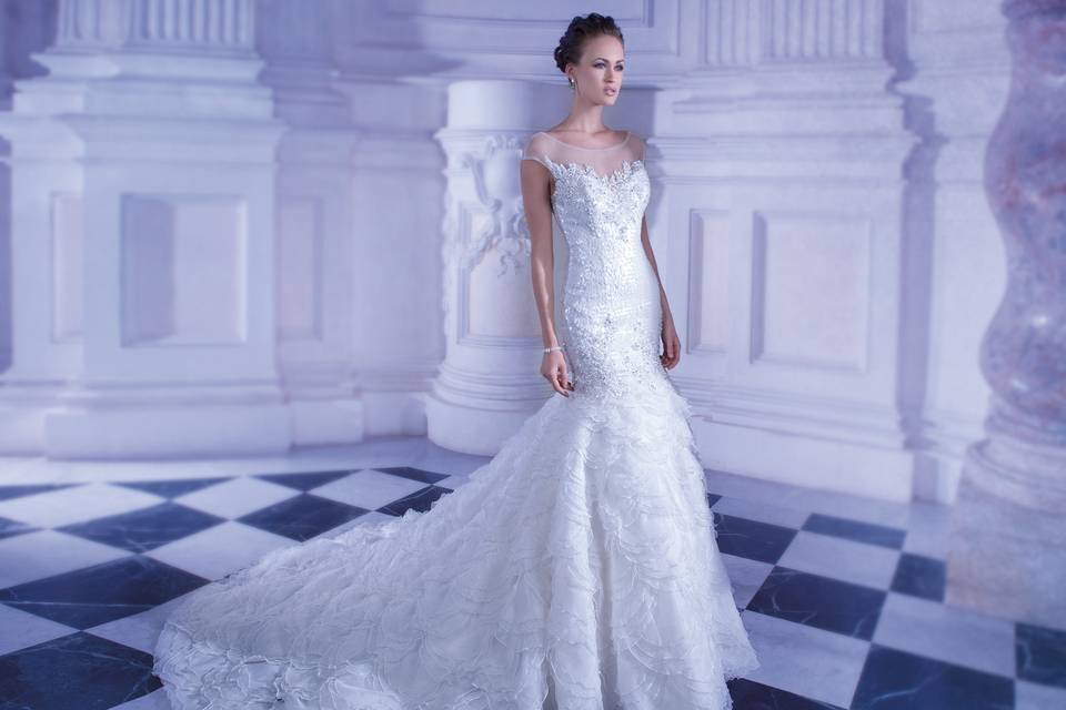 248Soft Tulle, One-shoulder A-line wedding gown with attached jewel-encrusted belt. This bridal dress has a Chapel train.