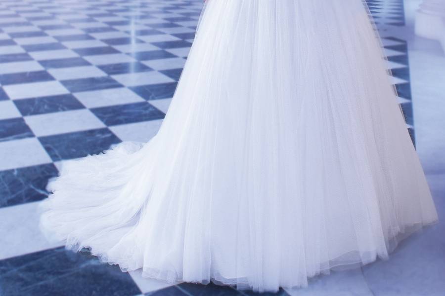 249Venice lace Corset, Strapless wedding gown with a scalloped neckline and dropped waist. The full Organza skirt on this bridal dress features a unique, intricate scroll design and attached Chapel train.