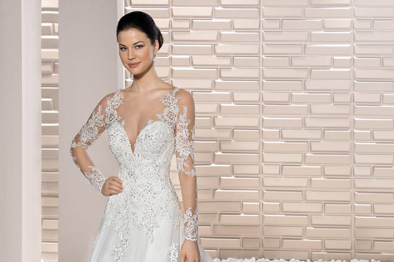 Style 728 <br> 	A Magnificent, optional detachable train adds a traditional touch to this strapless, sheath gown with Sweetheart neckline.  Delicately beaded lace embroidery adorns the entire gown including the Cathedral length train.