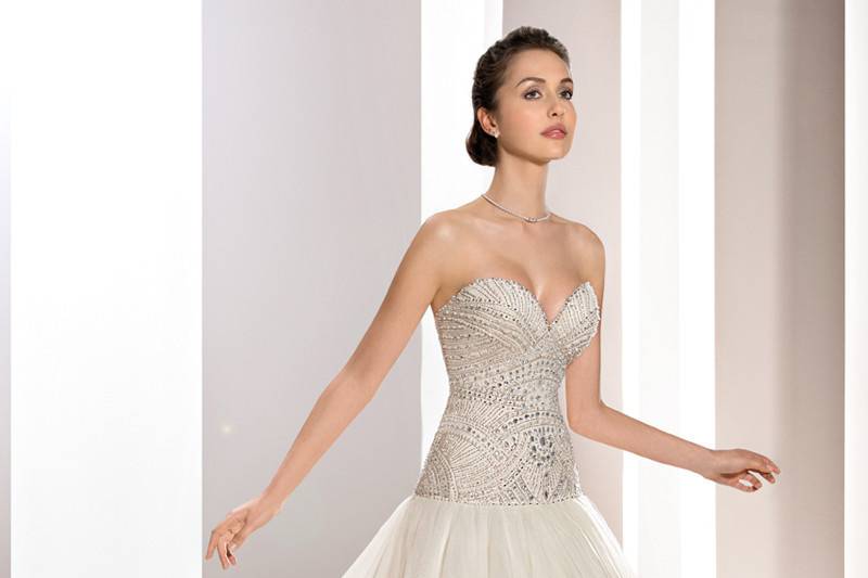 Style 726 <br>	Crystals, bugle beads and pearls create a magnificent bodice on this strapless Tulle gown with a Sweetheart bodice, dropped waist and Chapel train.
